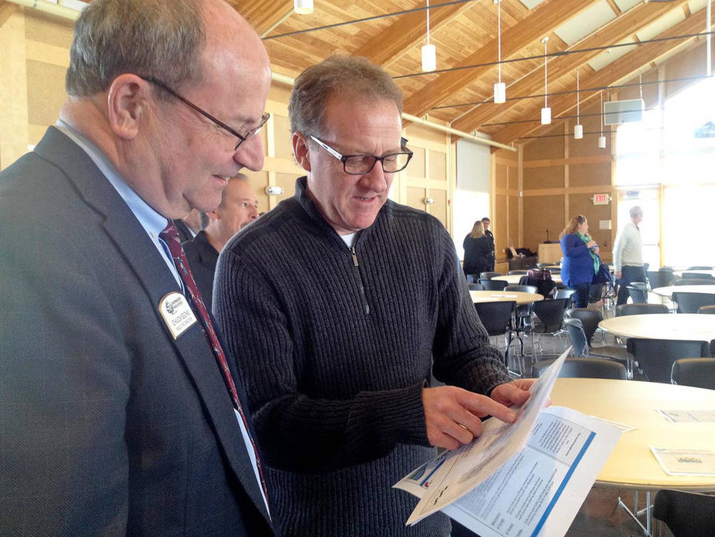 At the 2015 Channahon State of the Village Trustee Scott Slocum talks with a Channahon Park District representative. This year’s Channahon address with the Grundy County Chamber will be a breakfast held on March 16.