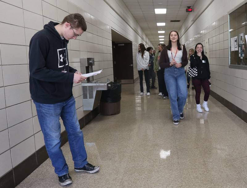 L-P High School students Emma Gochanour and Ethan Schmick lead a group of Naperville Students through the Area Career Center during a student swap tour on Tuesday April 18, 2023 at L-P High School.