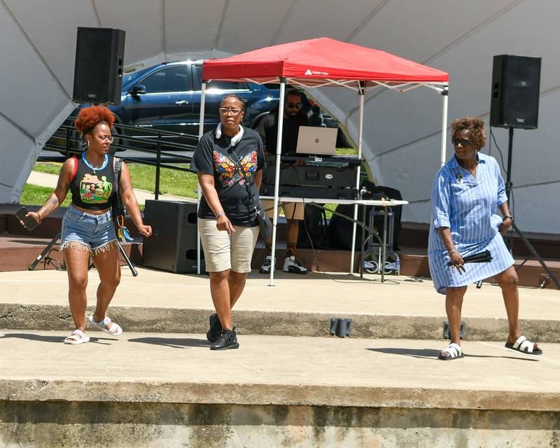 (From left) Stacie Miller, Denise Bailey and Bonita Gordon of DeKalb enjoy some dancing on Sunday, June 22, 2025, during DeKalb's annual Juneteenth Community Celebration held at Hopkins Park.