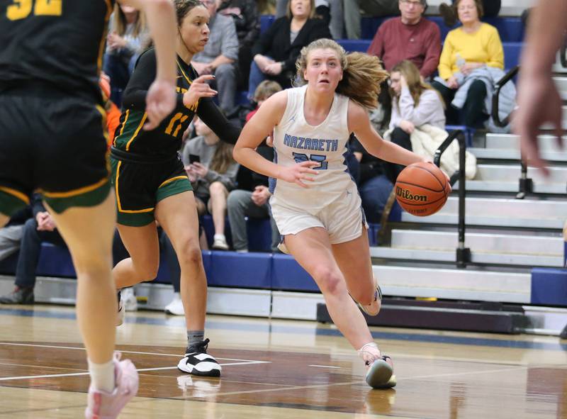 Nazareth's Amalia Dray (25) drives to the basket during the girls varsity basketball game between Fremd and Nazareth on Monday, Jan. 9, 2023 in La Grange Park, IL.