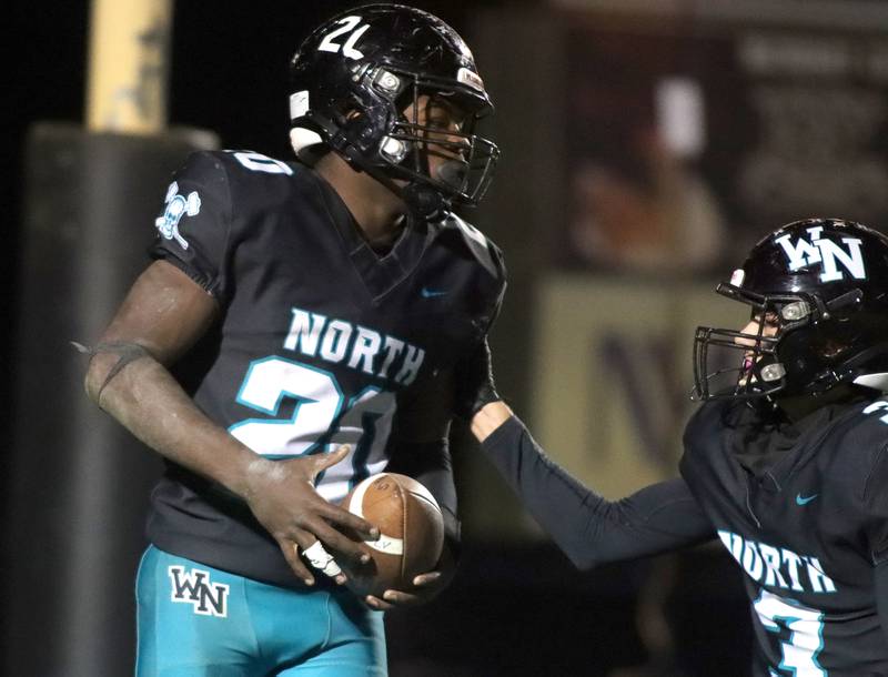 Woodstock North’s David Randecker, left, is greeted by Braden Berner in the end zone after a Randecker touchdown against Freeport in first-round IHSA Playoff football action on Saturday, Nov. 2, 2024 at Woodstock North High School in Woodstock.