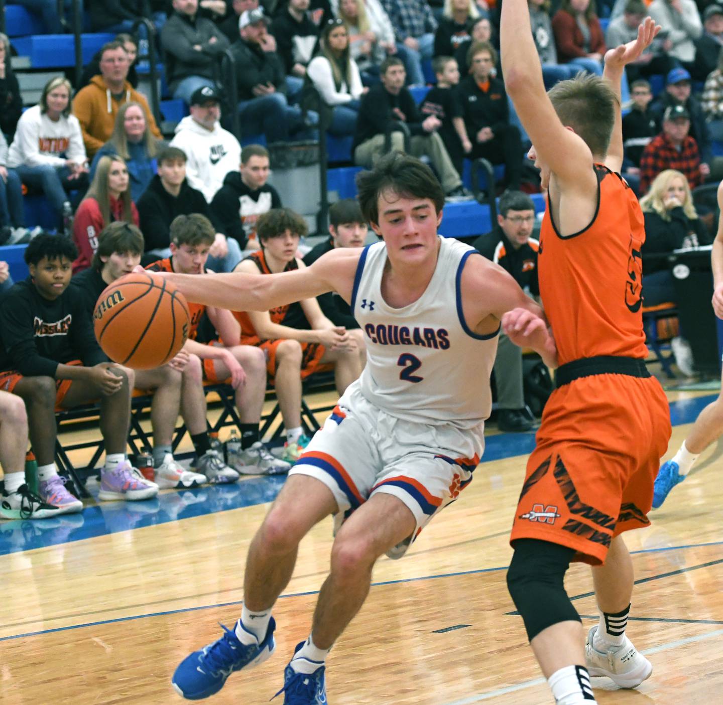 Eastland's Carsen Heeren (2) drives as Milledgeville's Bryce Aude defends during 1A regional action in Lanark on Saturday.