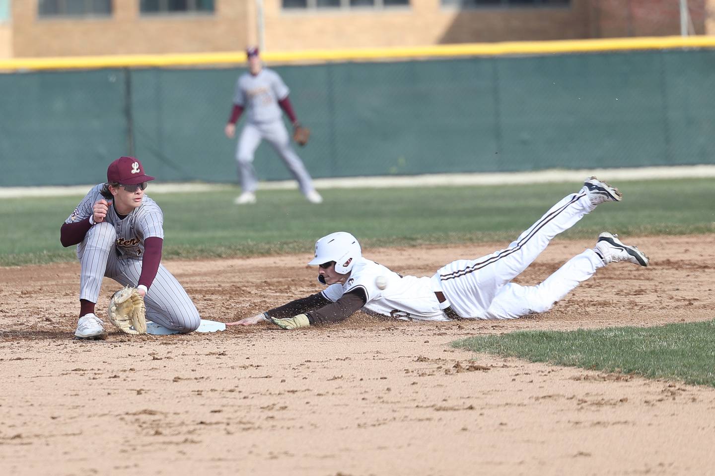 Joliet Catholic’s Matt Simmons steals second against Lockport on Wednesday, March 27, 2024 in Joliet.