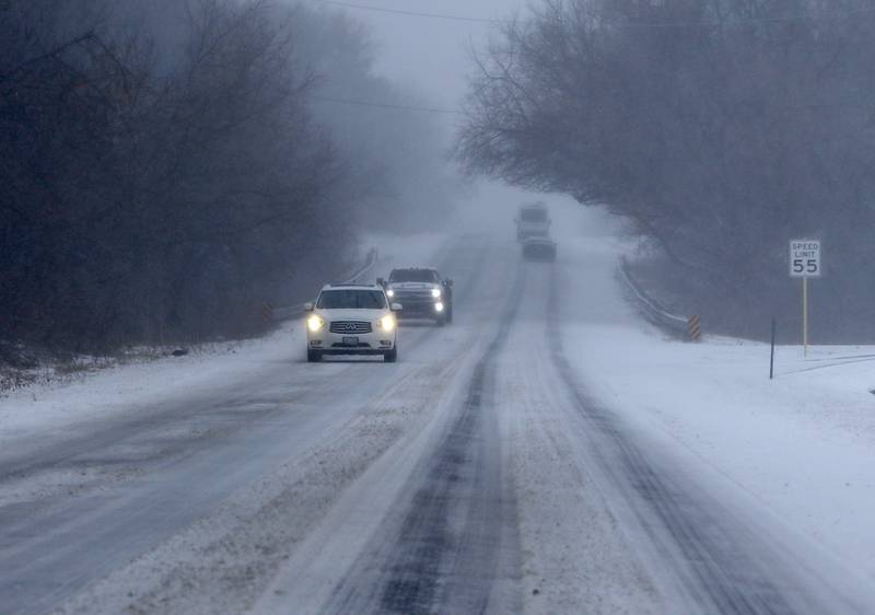Vehicles travel along Route 173 on Thursday, Feb. 16, 2023, in Spring Grove after a winter storm moved through McHenry County creating hazardous driving conditions.