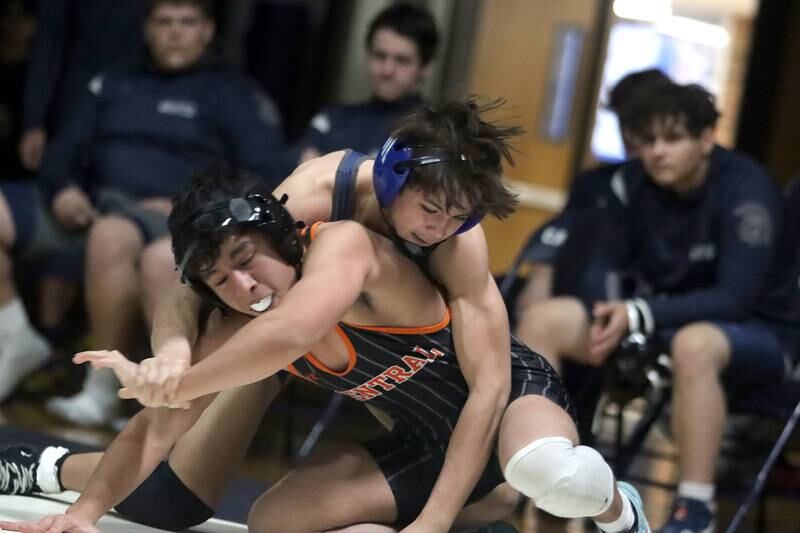 Crystal Lake Central’s Abe Pabmino, front, battles Cary-Grove’s Jacob Turner at 138 pounds in varsity wrestling Thursday, Dec. 19, 2024 at Cary-Grove High School in Cary.