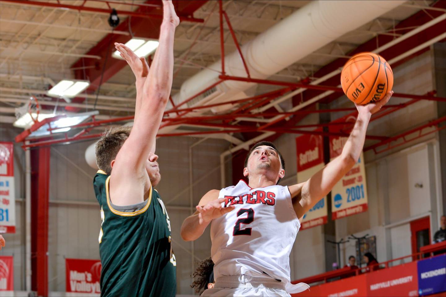 Lewis' Beau Frericks, a Cary-Grove graduate, goes up for a shot against Wayne State.