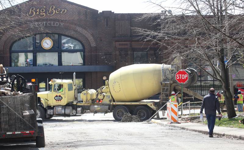 Crews pour a new sidewalk along U.S. 6 in front of the Westclox building on Monday, April 7, 2025 in Peru. The $6.4 million project is scheduled to be completed this summer, according to the release.