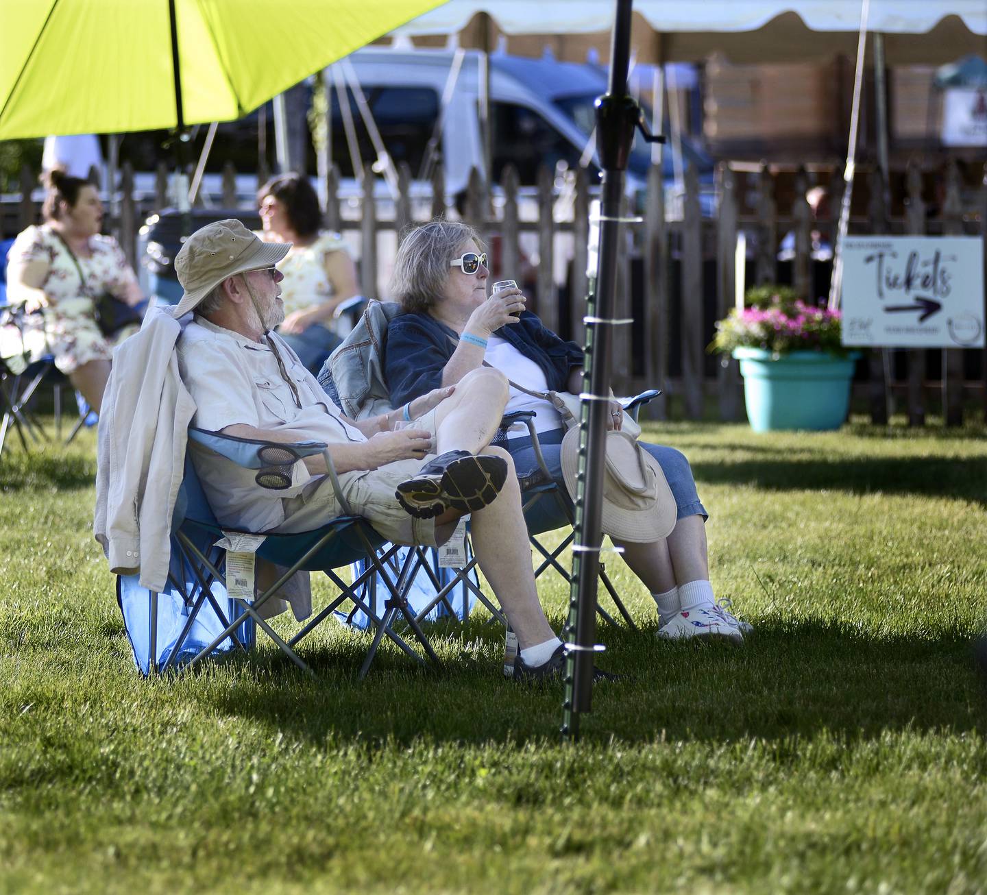 Fred and Debbie Kloese find a relaxing spot to enjoy their wine Friday, June 3, 2022, at Wine Fest in Ottawa.