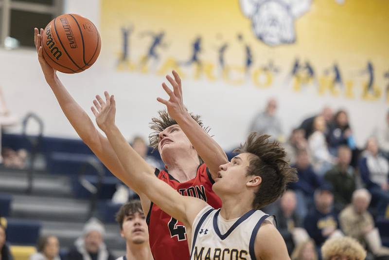 Fulton’s Landen Leu grabs a ball against Polo’s Gus Mumford Monday, Feb. 12, 2024 at Polo High School.