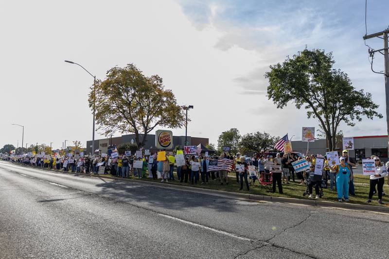 Protestors line Plainfield Road in Joliet during the No Kings Protest in Joliet on Oct. 18, 2025.