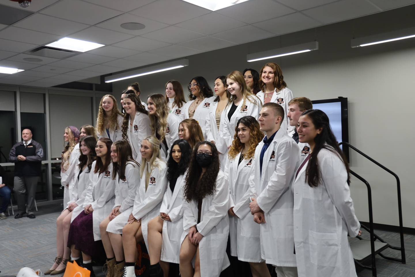 About two dozen McHenry High School students were honored Monday, March 14, 2022, in a white coat ceremony after they completed four years of the high school's medical program.