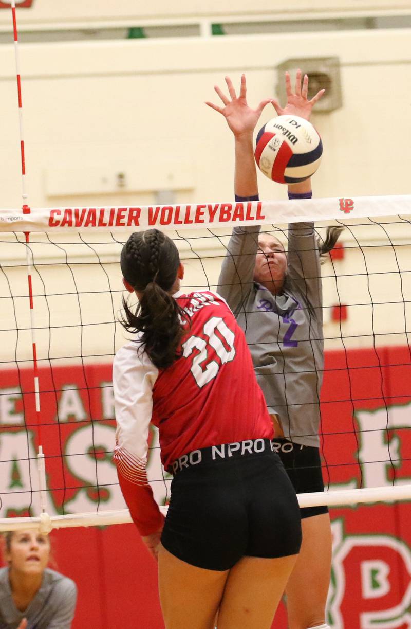 Rochelle's Jaydin Dickey goes up high for a block during their match with La Salle-Peru on Oct. 2, 2025.