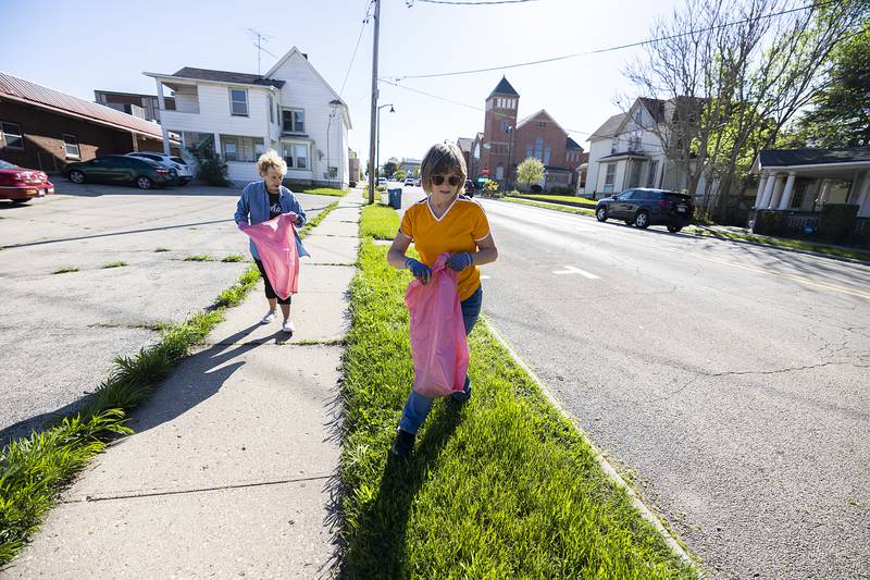 Debbie Nagy (right) and Kathy Johnson walk along Second Street in Dixon Wednesday, May 1, 2024 to pick up refuse for the Beautify Dixon campaign. The two remarked about how well maintained the streets have been so far.