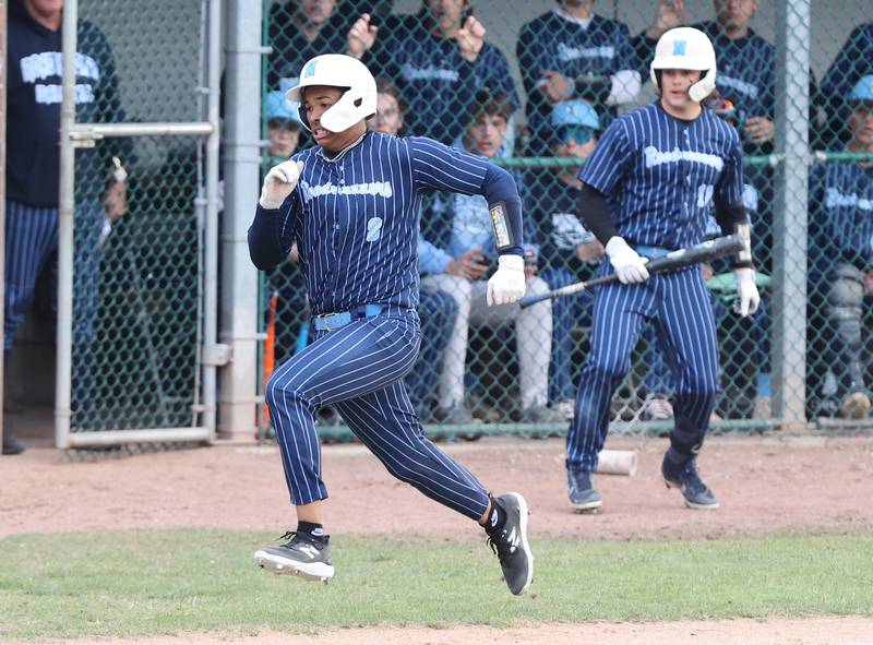 Nazareth's Jeremy Thompson (8) breaks for home during the varsity baseball game between Benet Academy and Nazareth Academy in La Grange Park on Monday, April 24, 2023.