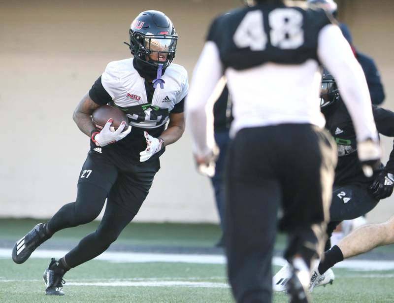 Northern Illinois University receiver Keyshaun Pipkin carries the ball during spring practice Friday, April 7, 2023, in Huskie Stadium at NIU in DeKalb.