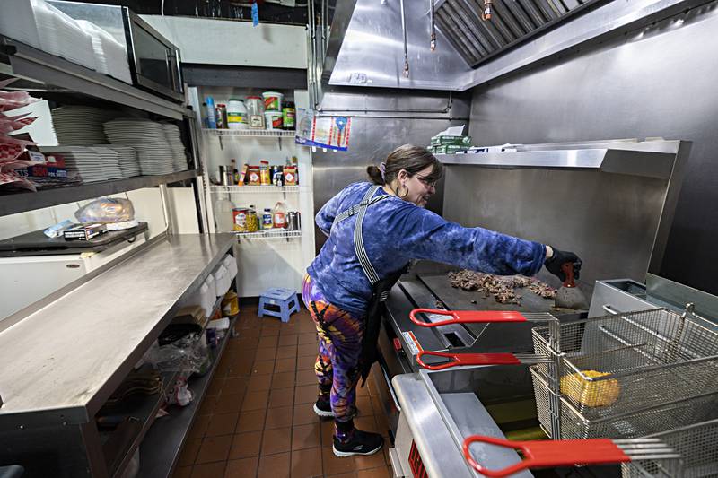 Celia Fernandez, owner/operator of Leo’s Marvelous Bites, works the grill for her Thor Empanadas Monday, Nov. 13, 2023. The Puerto Rican restaurant has made waves in the Sauk Valley due to their food truck and catering business and now has a permanent spot in downtown Dixon.