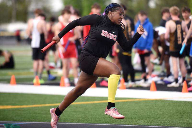 Momence's Amya Johnson takes off to start the 4x100 m relay at the Herscher Invite Friday, May 2, 2025.