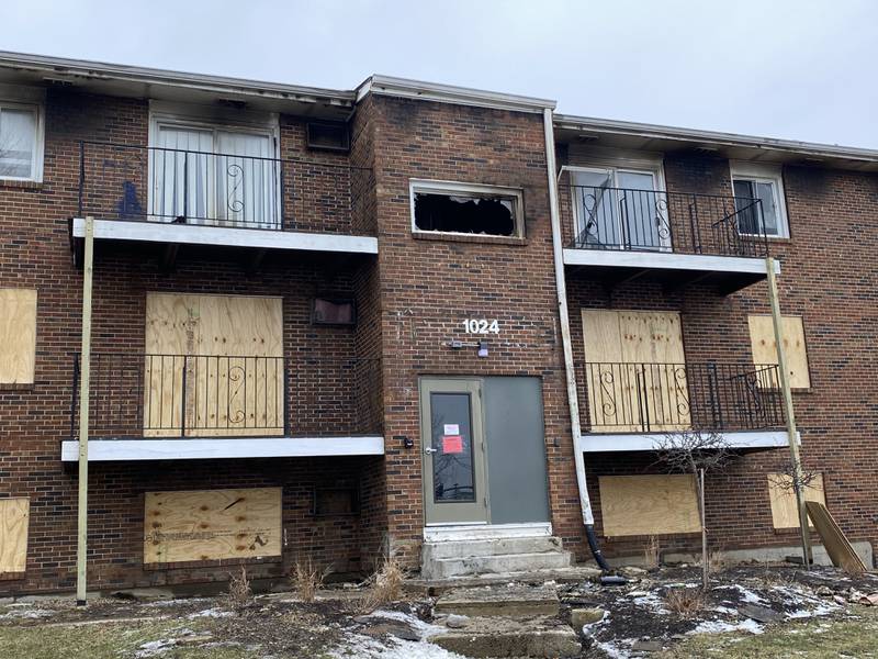The heavily-damaged apartment building at 1024 W. Hillcrest Drive, DeKalb, on Monday, Dec. 23, 2024, sits with boarded up windows less than 24 hours after a fire destroyed much of the residential complex. The City of DeKalb condemned the building and ruled two nearby ones uninhabitable, displacing about 60 residents days before Christmas.