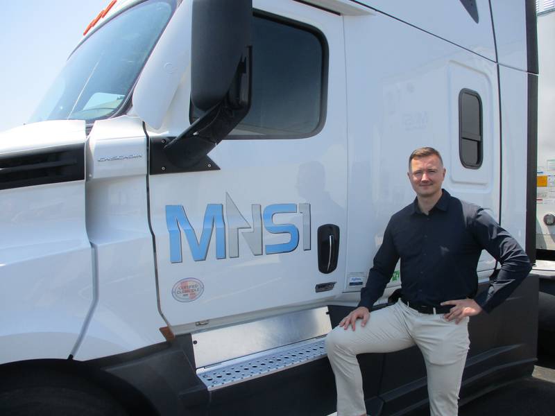 Mike Narkys, president of MNS1 Express Inc., stands with one of the company trucks at his new Plainfield facility. June 1, 2023.