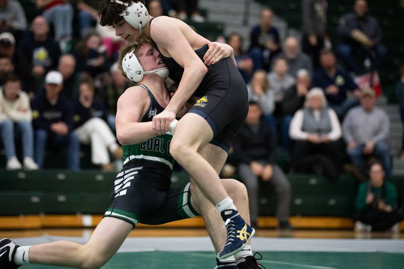Coal City's Max Christensen, left, and Yorkville's Adrian Wadas-Luis wrestle in the 144-pound match during the IHSA Class 1A Coal City Dual Team Sectional on Thursday, Feb. 5, 2026.