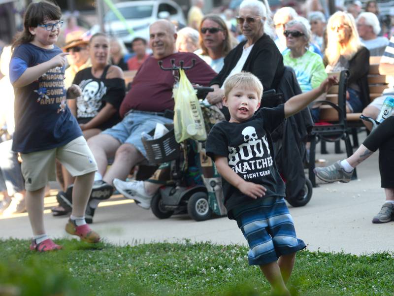 Kamdyn Larson, 5, of Oregon (right) and Jonathan Zell, 9, of Polo, (left) dance to a tune by Jonny Lyons and the Pride at the Mt Morris Jamboree on Friday, June 27, 2025.