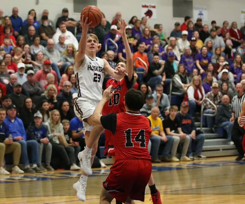 Serena's Tanner Faivre eyes the hoop as Earlville's Easton Fruit and teammate Oliver Munoz defend during the Little Ten Conference Championship on Friday, Feb. 2, 2024 at Somonauk High School.