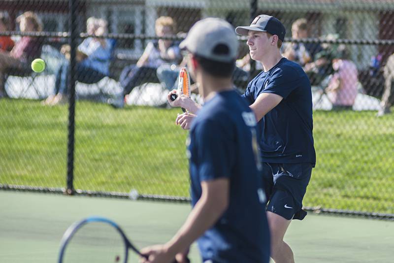 Sterling’s Luke Valentino returns a shot against Newman Monday, May 9, 2022. Valentino and doubles partner Connor Pham faced off against the Comets’ Tyler Bonnell and Koda Brininger.
