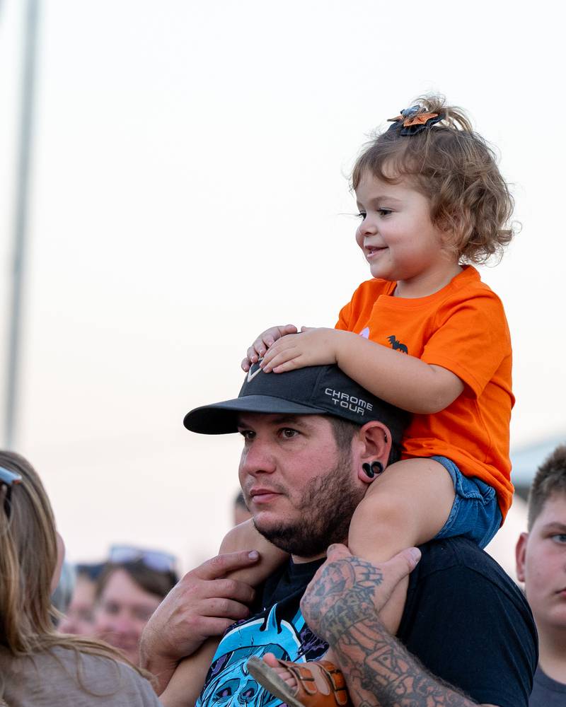Child sits on father's shoulders at the Monster Mash Balloon Bash on Saturday, Oct. 4, 2025 at the Bureau County Fairgrounds in Princeton.