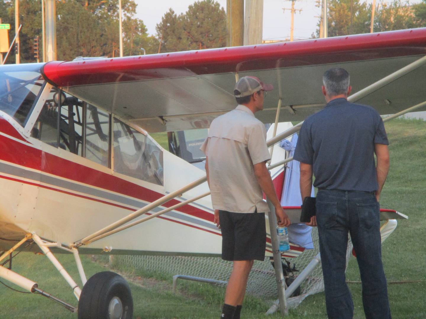 Beau Klingbeil, aviation safety inspector with the Federal Aviation Administration, examines the airplane that made an emergency landing in Joliet on Thursday. Aug. 14, 2025