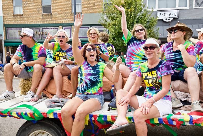 Members of a class float cheer and wave to the crowd during the 50th annual Homestead Festival Parade in Princeton on Saturday, Sept. 11, 2021.