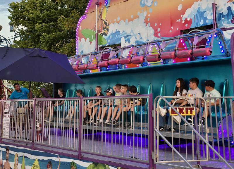 Carnival goers get ready to ride the Riptide at the Seneca Days carnival Saturday, Sept. 21, 2024.