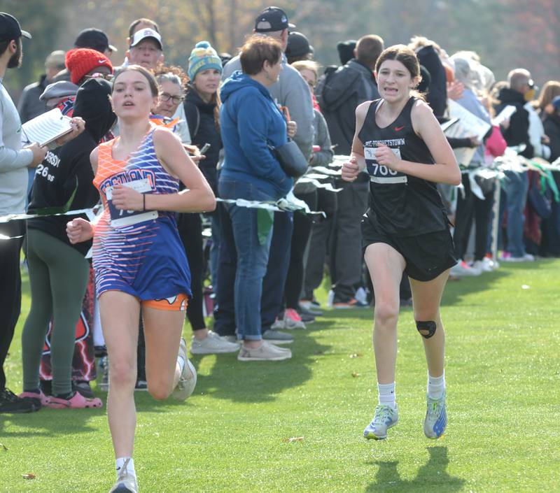 Eastland's Adelle Wilkinson and Erie-Prophetstown's Alana Little race to the finish line at the 1A Rock Island Cross Country Sectional on Saturday, Nov. 2, 2024 at Saukie Golf Course in Rock Island.