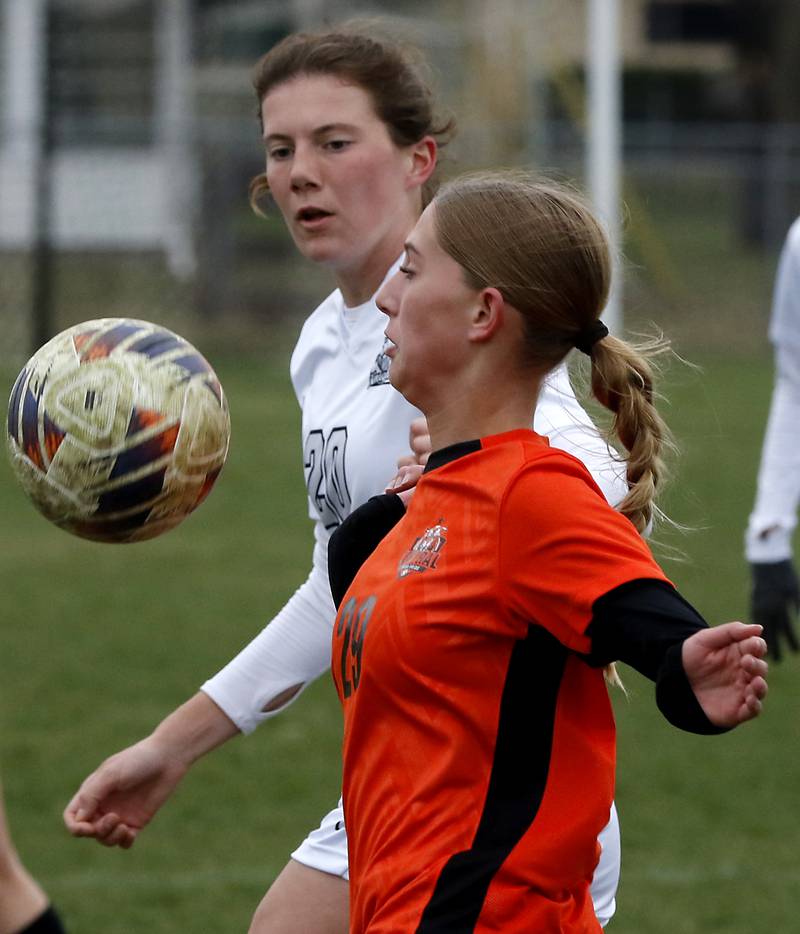 Kaneland's Erin Doucette and Crystal Lake Central's Charlotte Wallner tries to control the ball during a nonconference soccer game on Thursday, April 10, 2025, at Crystal Lake Central High School.