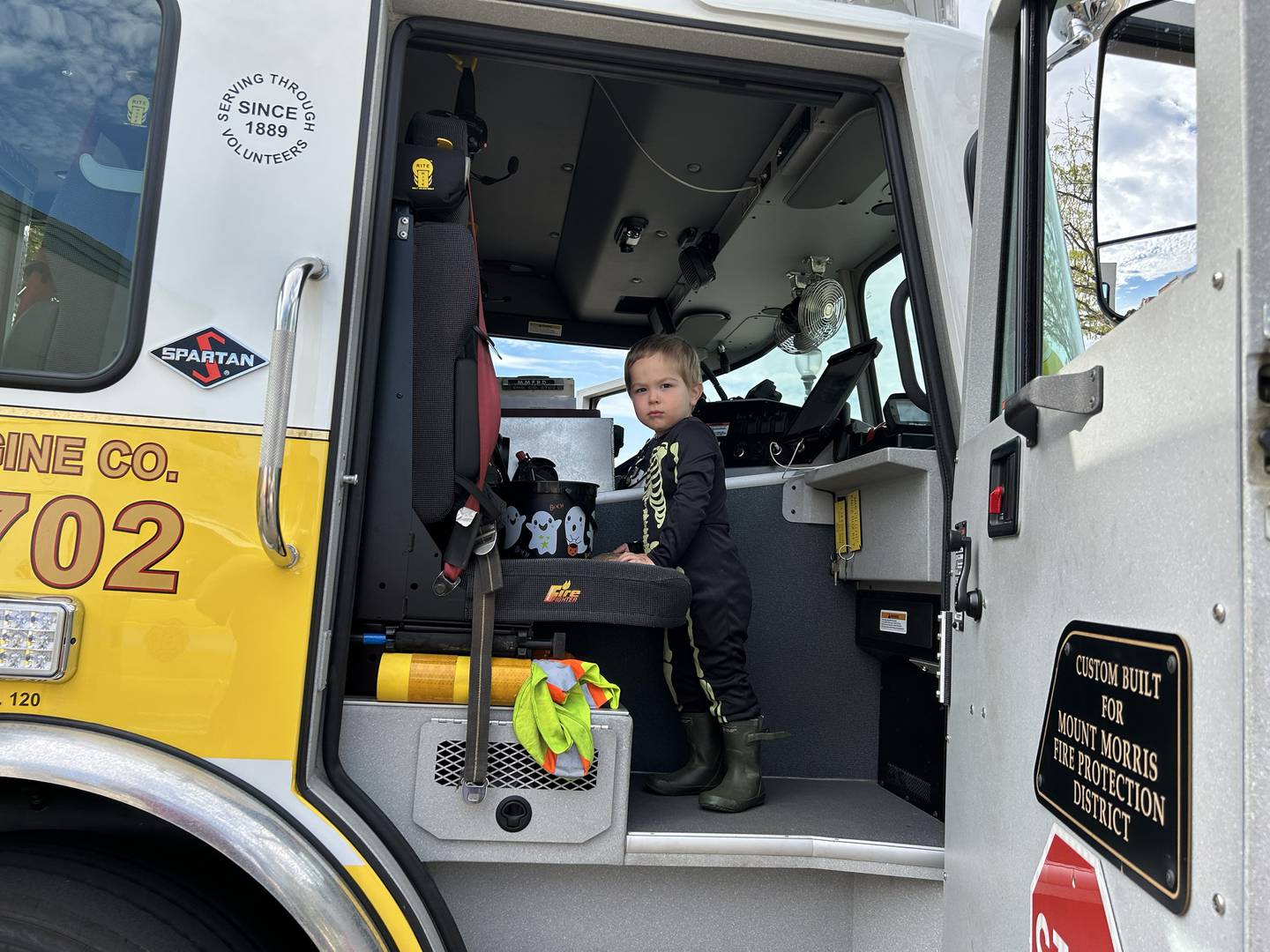 Azrael Slattery, 2, checked out the big Mt. Morris fire engine during Let Freedom Ring's Fall Family Festival on Sunday, Oct. 12, 2025.  The downtown event included a trunk or treat event, car show and kids' games.