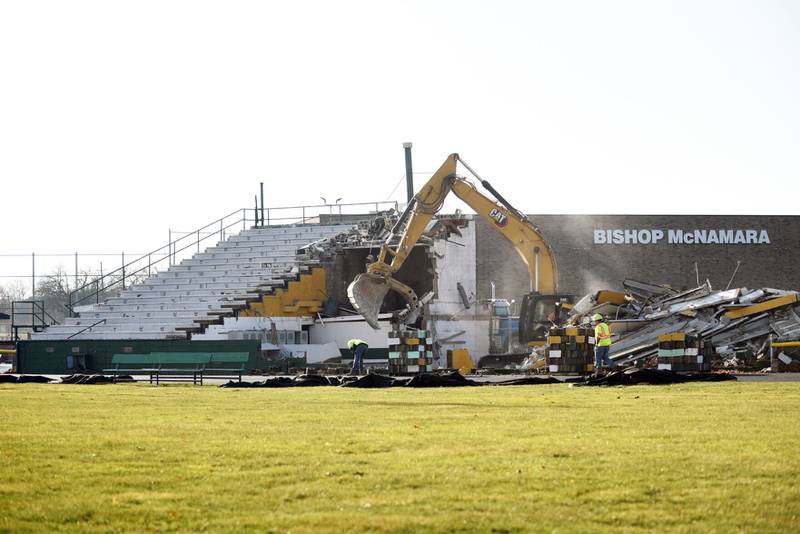 Construction workers complete the teardown of Bishop McNamara’s Rich Zinanni Stadium Monday. The school will construct a new stadium ahead of the 2025-26 school year.