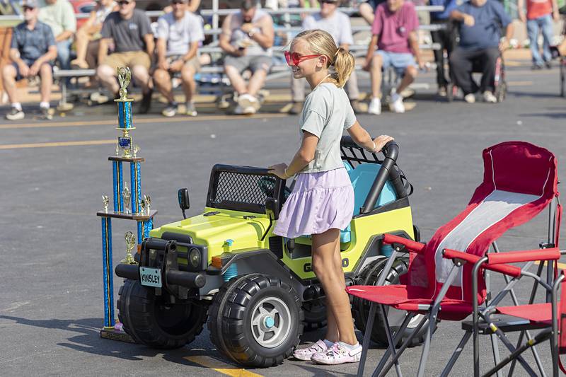 Kinsley Ward, 10, of Byron stands with her Miss Amboy Favorite Award trophy Sunday, Aug. 25, 2024, during the Depot Days car show. Ward did an off-the-frame restoration of the 30-year-old Jeep.