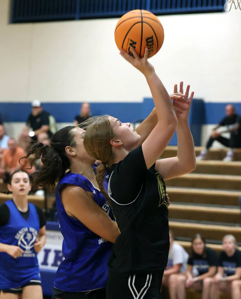 Sycamore’s Macy Calendo goes to the basket in front of a Geneva defender Thursday, June 12, 2025, in the Geneva High School Varsity Summer League.