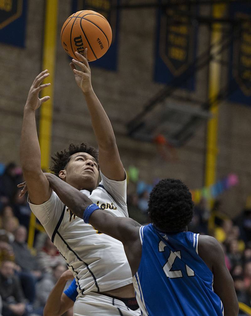 Sterling’s Koby Bell is fouled by Quincy’s Milton Whitfield Friday, Jan. 30, 2026.