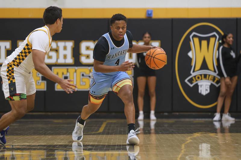 Kankakee’s Myair Thompson works the ball up court against Joliet West on Wednesday, Feb. 18, 2026 in Joliet.