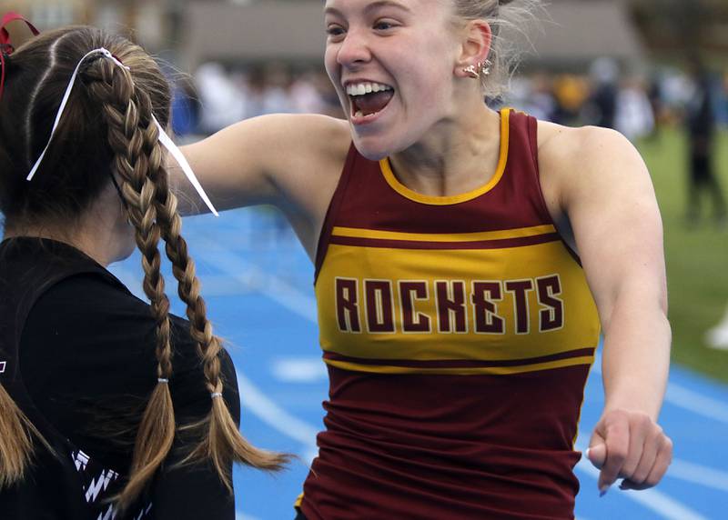 Richmond-Burton’s Emily Wisniewski (right) celebrates with Marengo’a Olivia Walter after after competing in the 100 meter hurdles during the Kishwaukee River Conference Girls Track and Field Meet on Tuesday, May 5, 2025, at Woodstock High School.