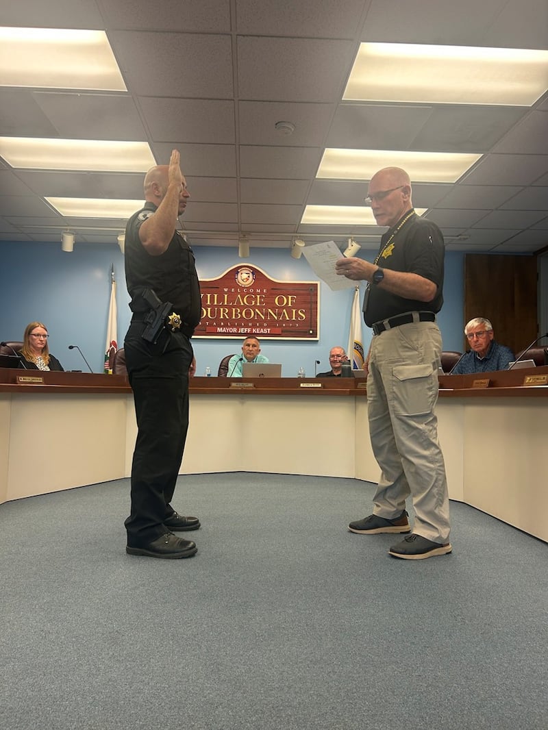 Bourbonnais Police Chief Dave Morefield, right, swears in Brent Barrie as the department's patrol commander Sept. 2, 2025.