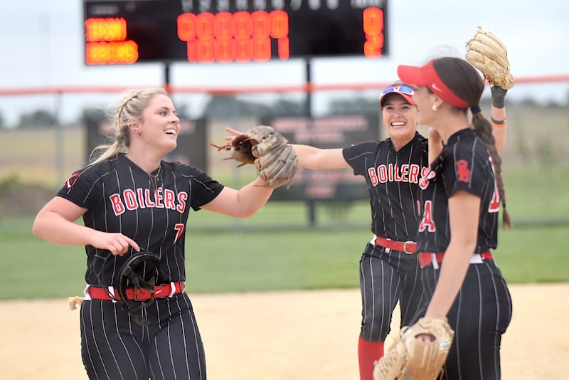 From left, Bradley-Bourbonnais' Lydia Hammond, Shannon Lee and Liv Woolman congregate to celebrate the Boilermakers' 2-0 victory over Normal Community in the Class 4A Normal Community Regional championship Friday, May 22, 2026.