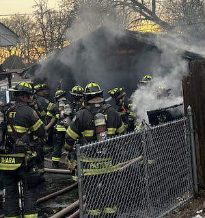 Crews battle Joliet garage fire