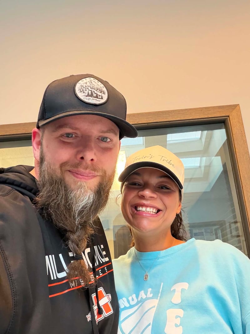 Tevin’s Tribe founder Lauren Metzler (right) poses for a picture with WIXN Morning Show host and News Director Brandon Clark (left) following her appearance on Talk Line on June 18, 2026.