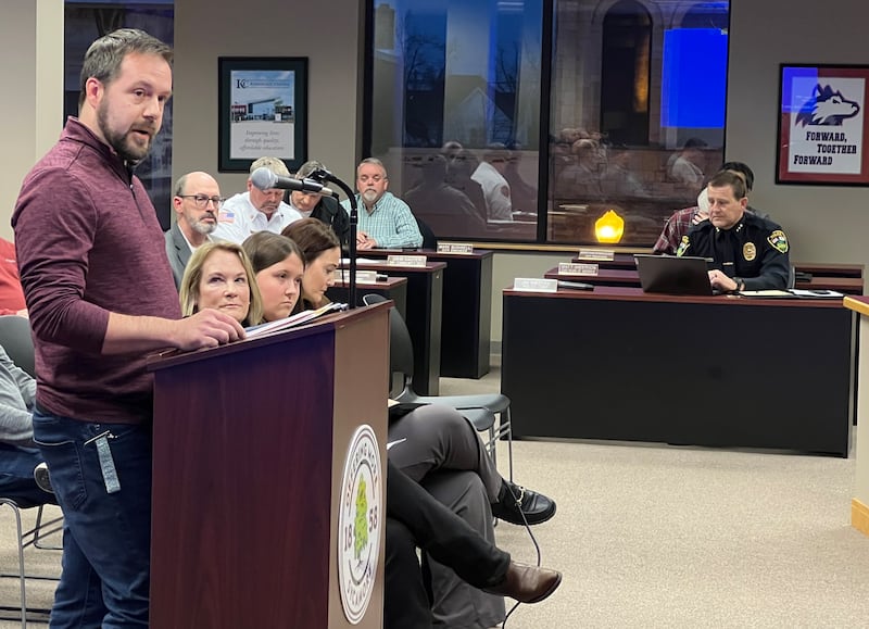 Sycamore business owner Christopher Mitchell criticizes the Sycamore Chamber of Commerce at a Sycamore City Council meeting on March 3, 2025 while the chamber's executive director RoseMarie Treml turns her head to listen.