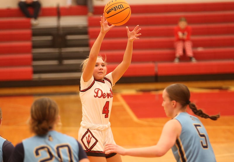 Hall's Charlie Pellegrini lets go of a jump shot over Marquette's Kaitlyn Davis and Chloe Larson on Thursday, Feb. 13, 2025 at Hall High School.