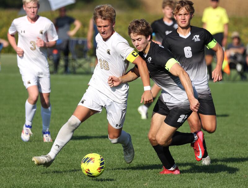 Sycamore's Gavin Crouch (left) and Kaneland's Jackson Boryc battle for possession during their game Wednesday, Sept. 16, 2025, at Kaneland High School in Maple Park.