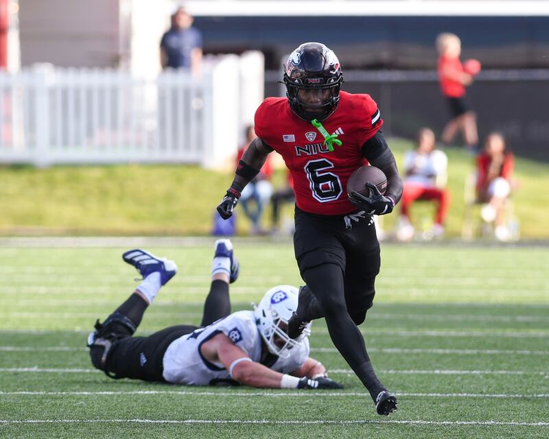 Northern Illinois University's wide receiver DeAree Rogers (6) gets passed Holy Cross defenders during the game on Saturday Aug. 30, 2025, held at Huskie Stadium in DeKalb.