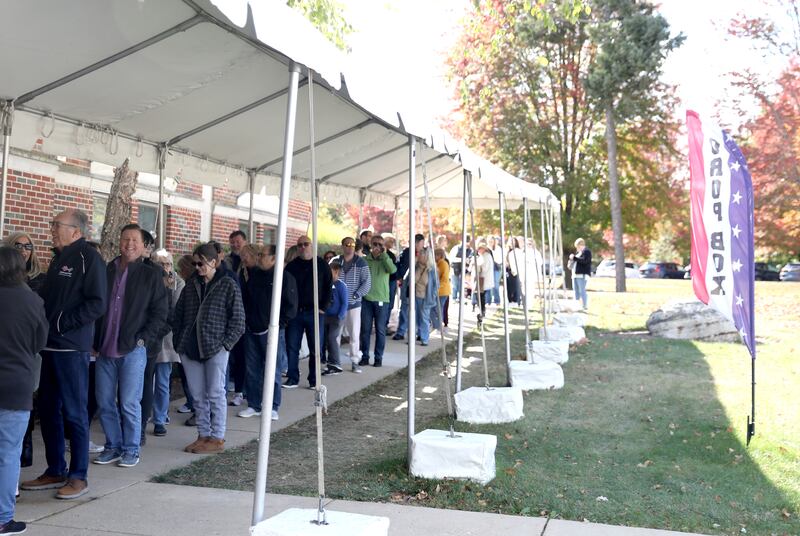 Voters wait in line on Tuesday, Oct. 15, 2024 at the Kane County Clerk’s office to vote early in the 2024 General Election.