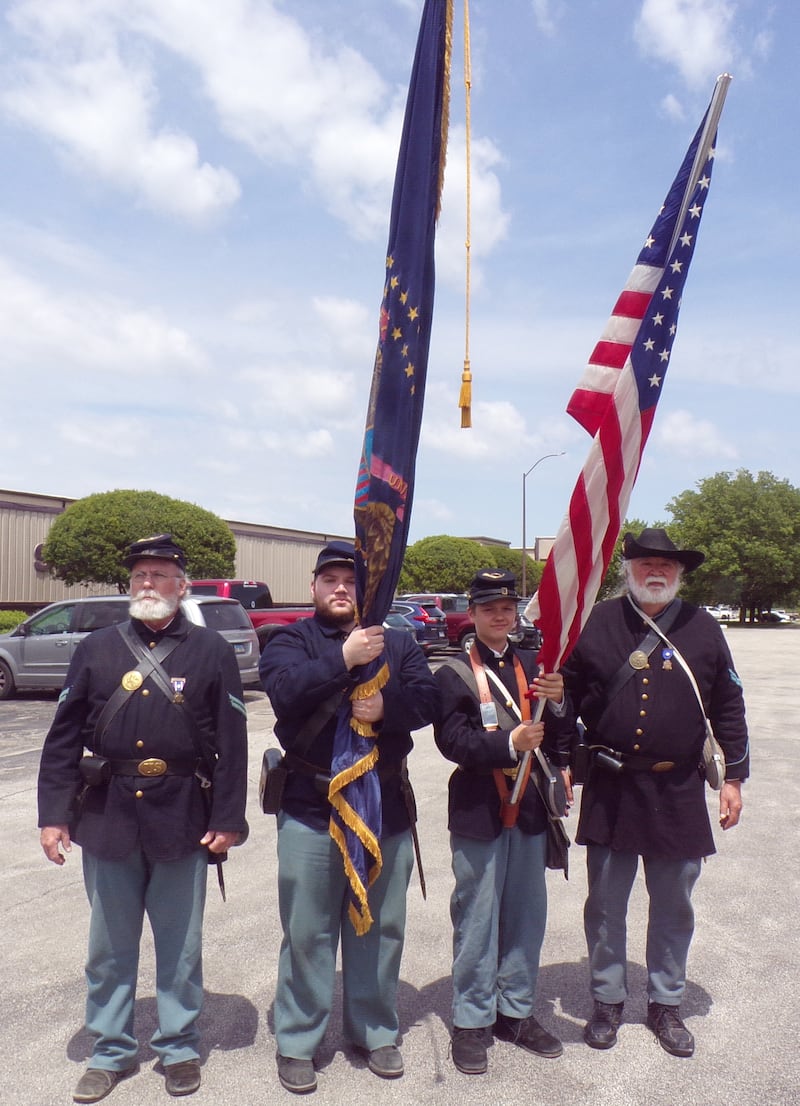 The 100th Illinois Civil War reenactors participated in the Ray Olley Memorial Day ceremony on Saturday, May 24, 2025. From left: Steven Ashby, Mike Melai, George Helwich, who spoke at the event, and Andy Partak.